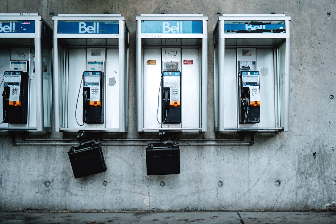 about-01 Vintage Bell telephone booths on a Toronto street representing urban nostalgia.